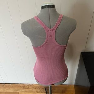 Pink Lululemon tank with bra. unsure of size, price reflecting
